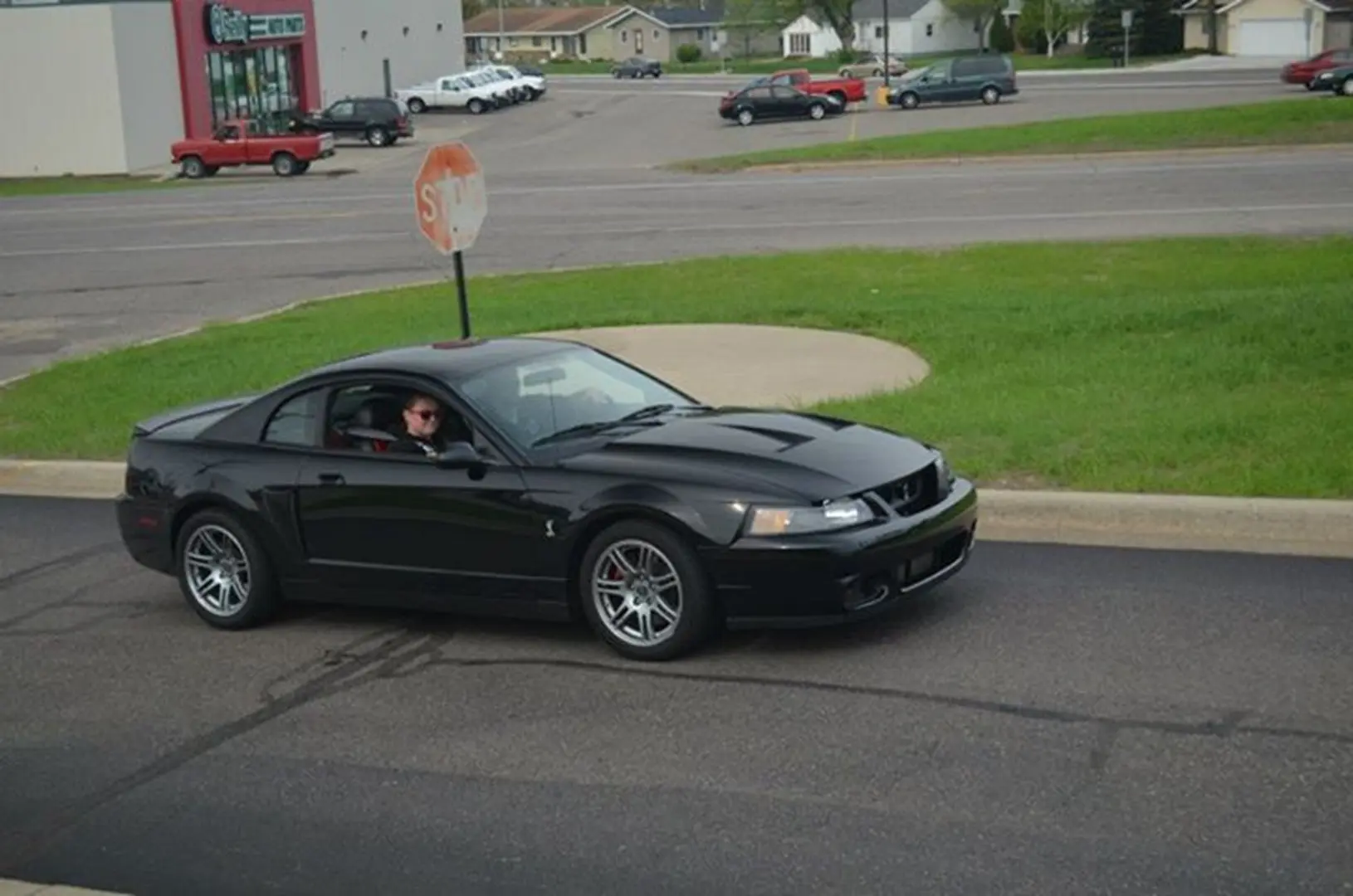 Black sports car on urban road