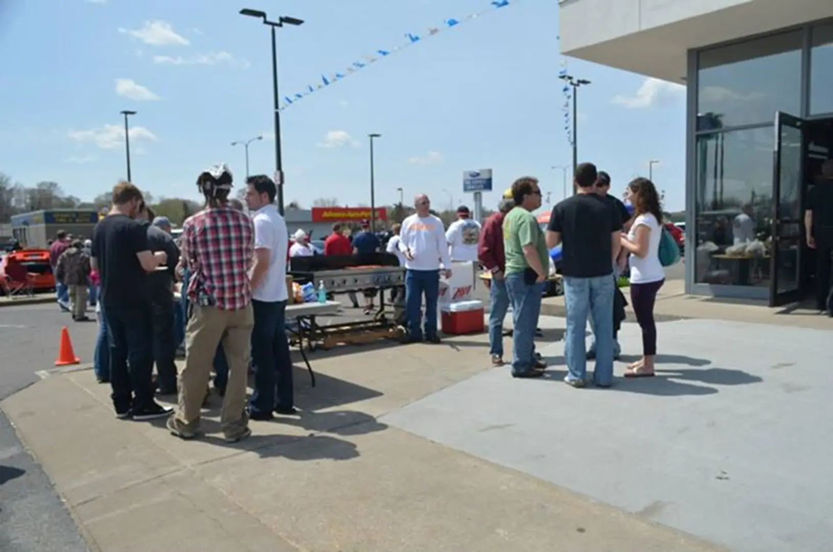 People gathering outside on a sunny day