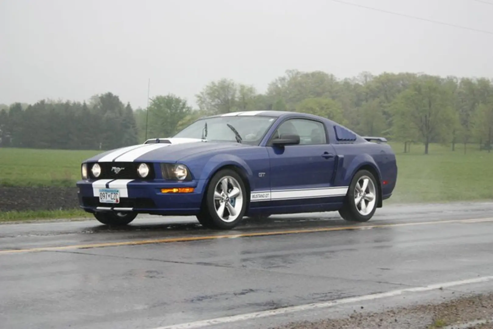 Classic blue sports car parked outdoors