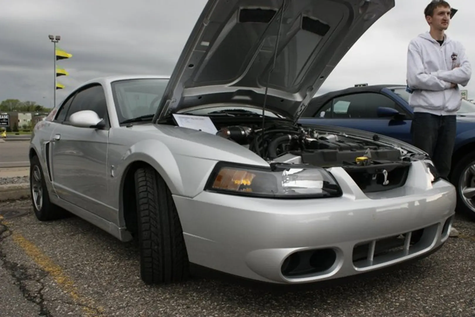 Car show with open hood vehicle
