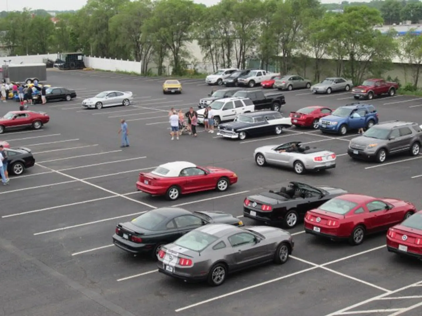 Cars parked in a large parking lot.