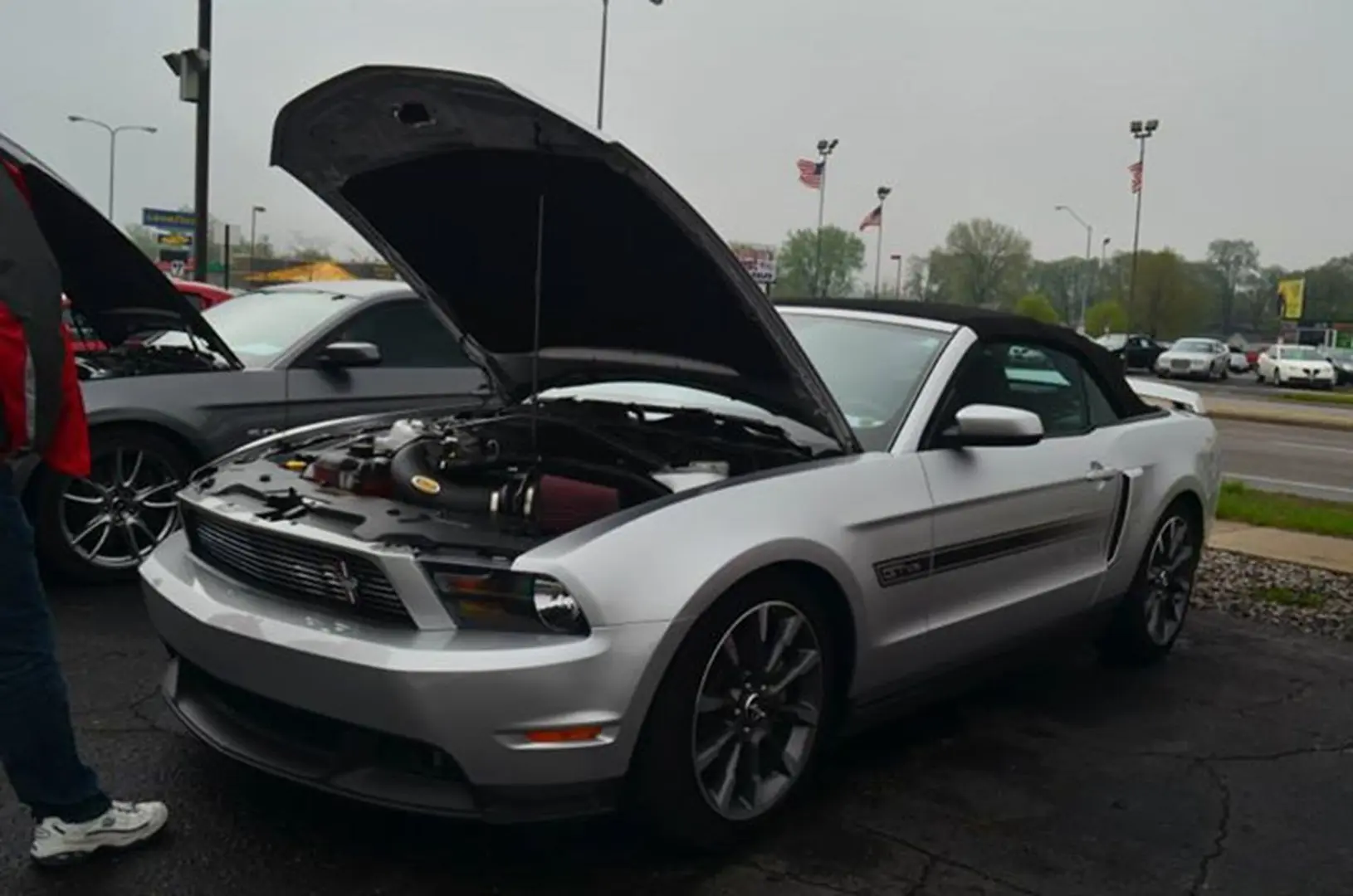 Convertible car parked with hood open