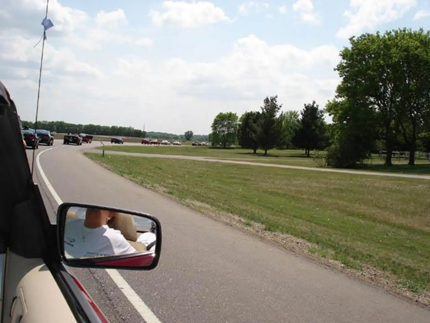 Cars driving on a sunny road