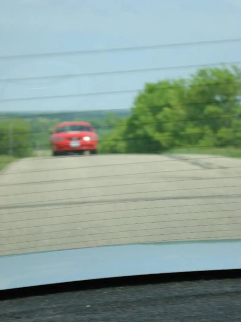 Red car on a country road