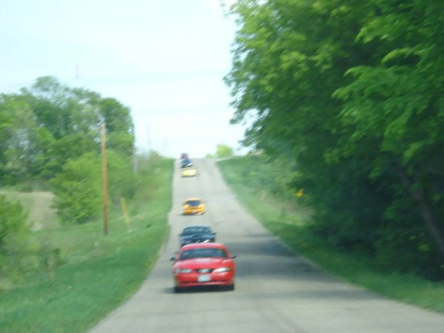 Vehicles traveling through countryside scenery