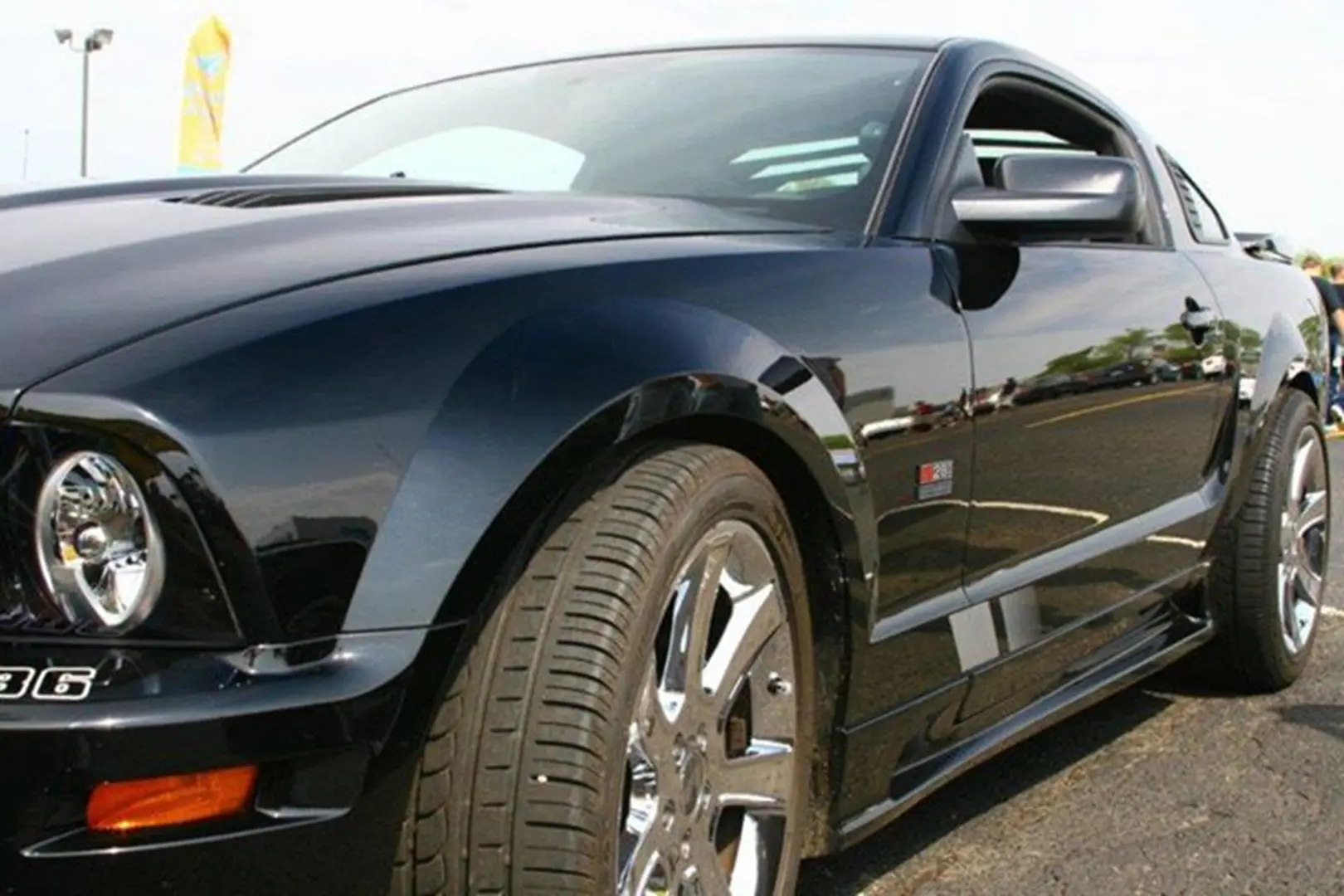 Black sports car in parking lot