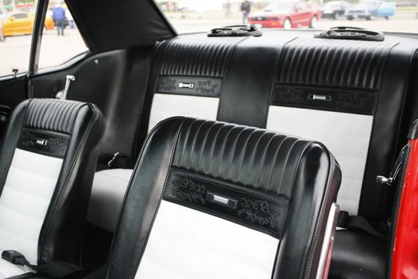Retro vehicle seating, black and white upholstery.