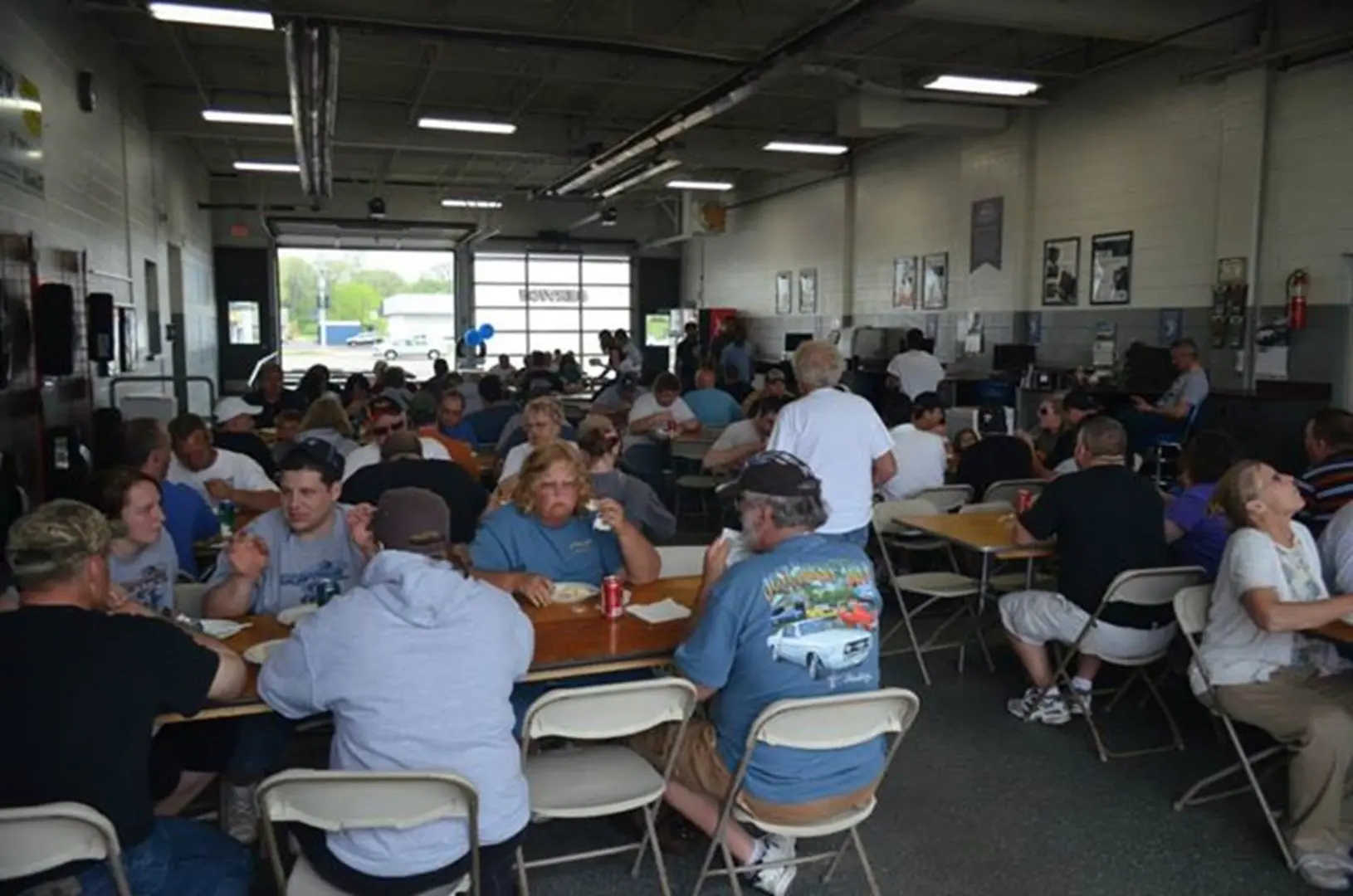 People eating in a busy cafeteria