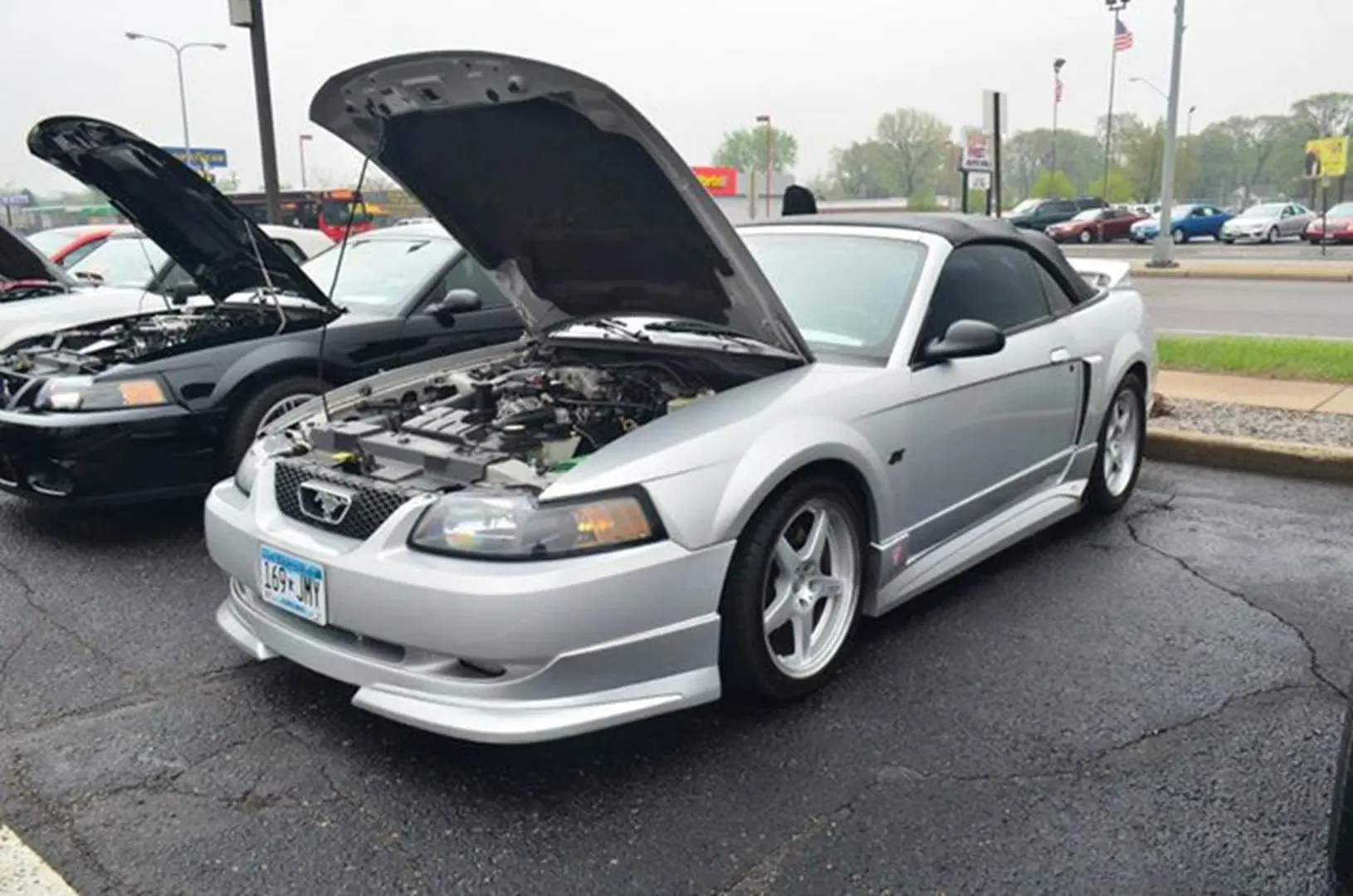Silver convertible sports car with hood open