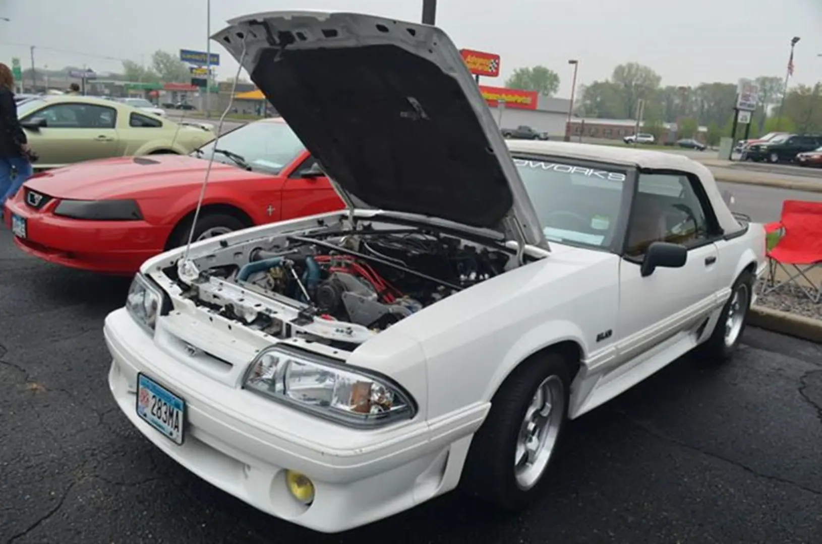 White convertible car with hood open
