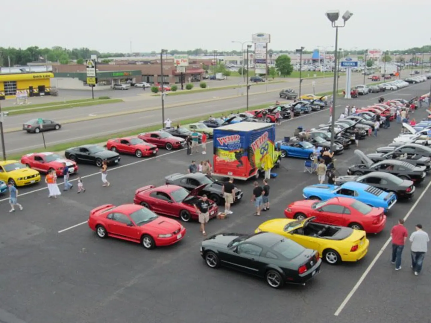 Busy car meet in parking lot