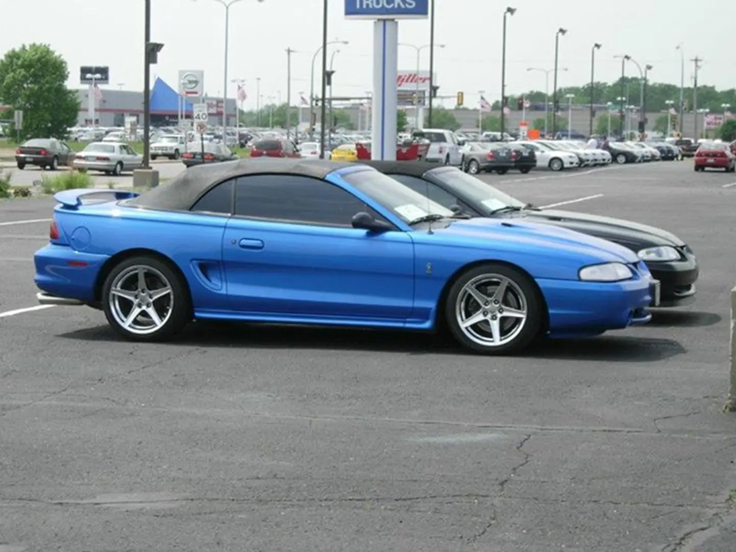 Blue sports car parked in lot