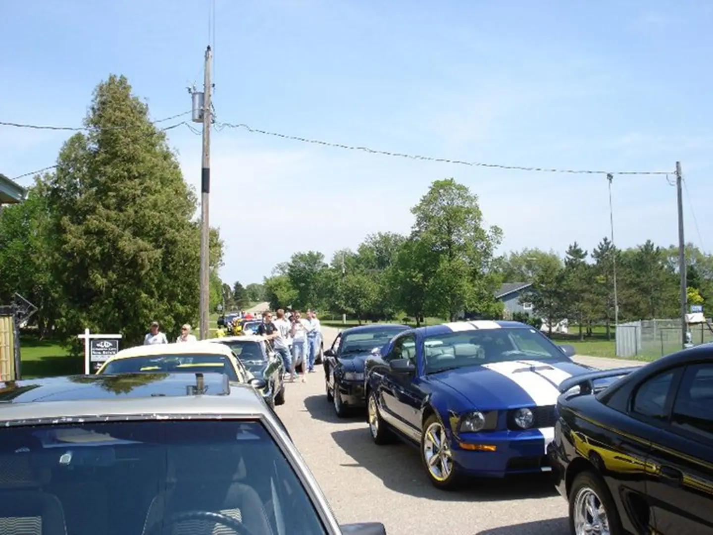 Cars parked along a sunny street