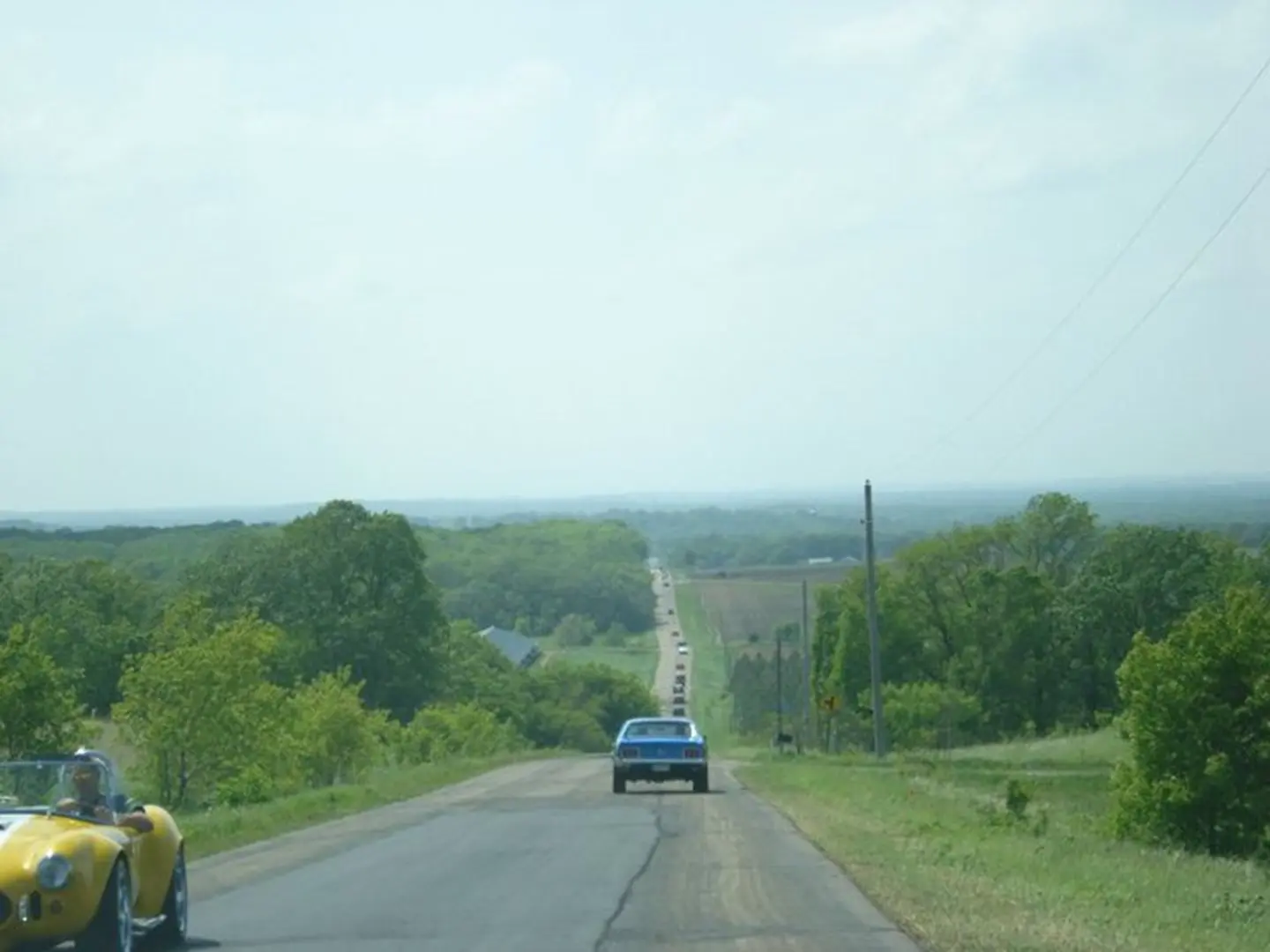 Vintage cars on rural road