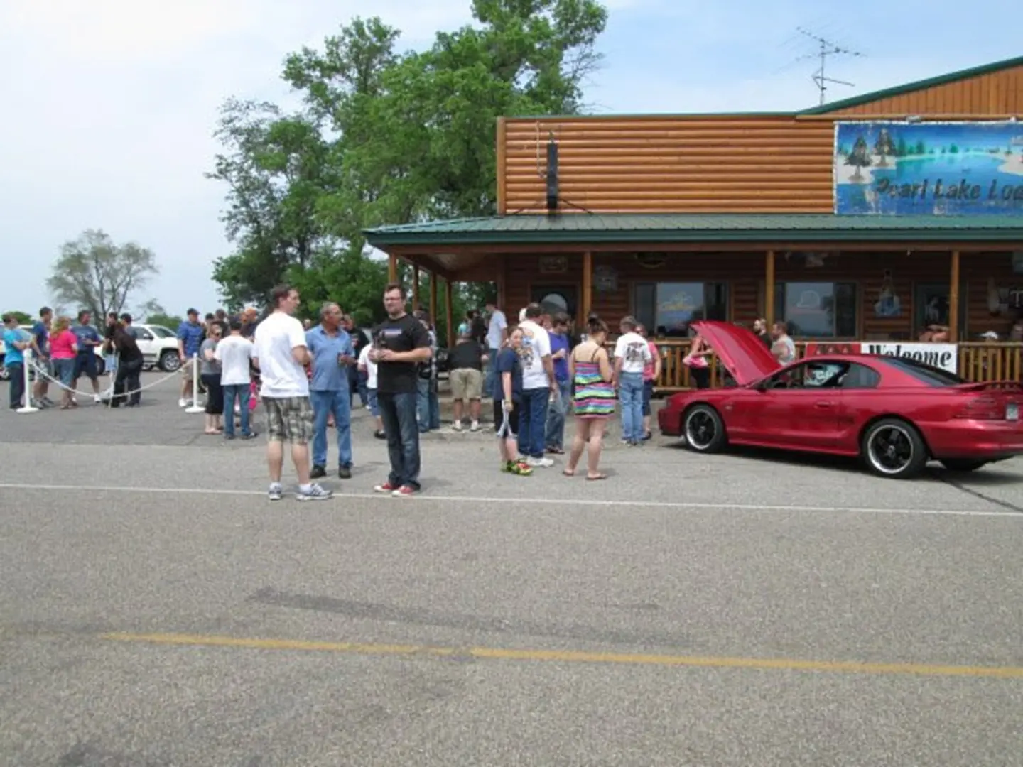 Red car with open hood