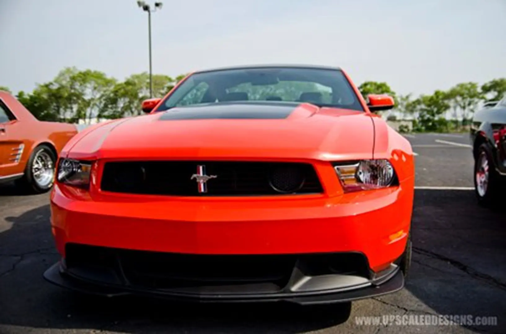 Orange sports car in sunlight