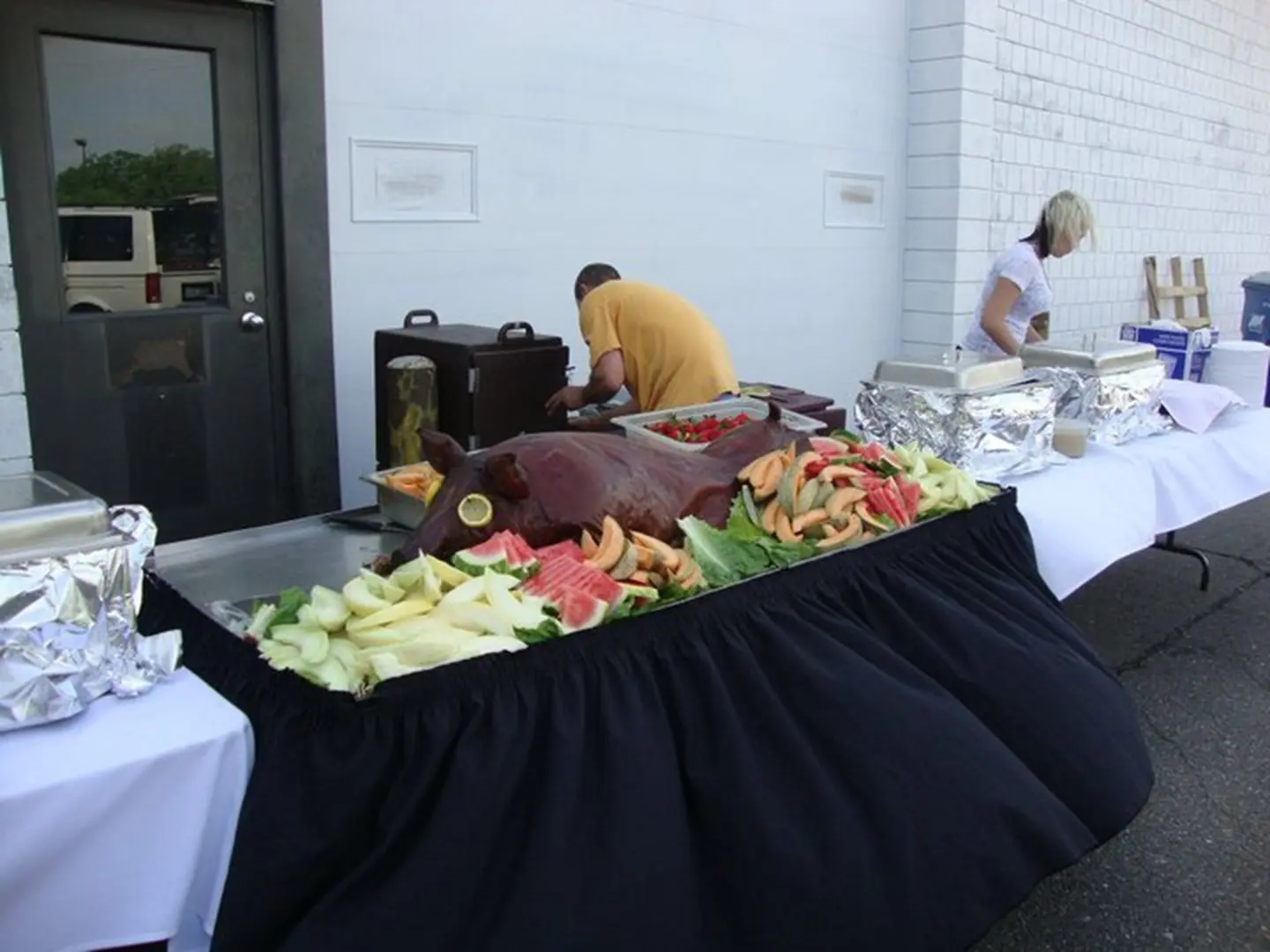 Buffet table with fruit and meat