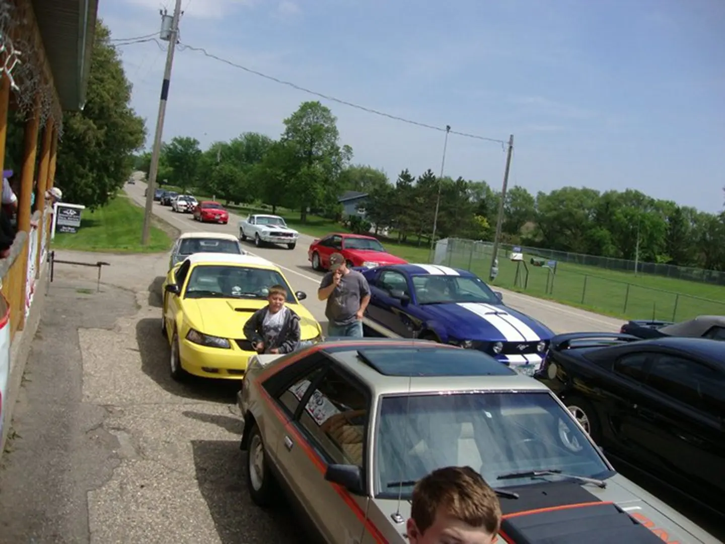 Cars parked along a rural road