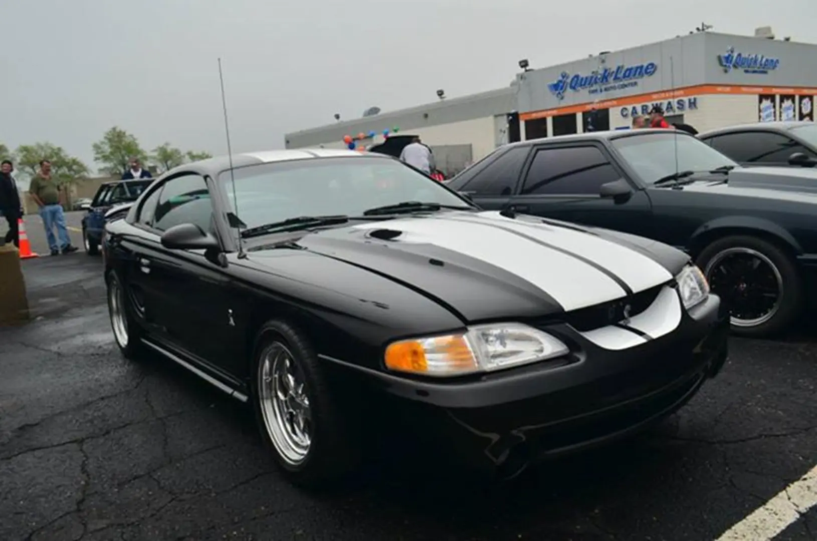 Sleek black car in parking lot