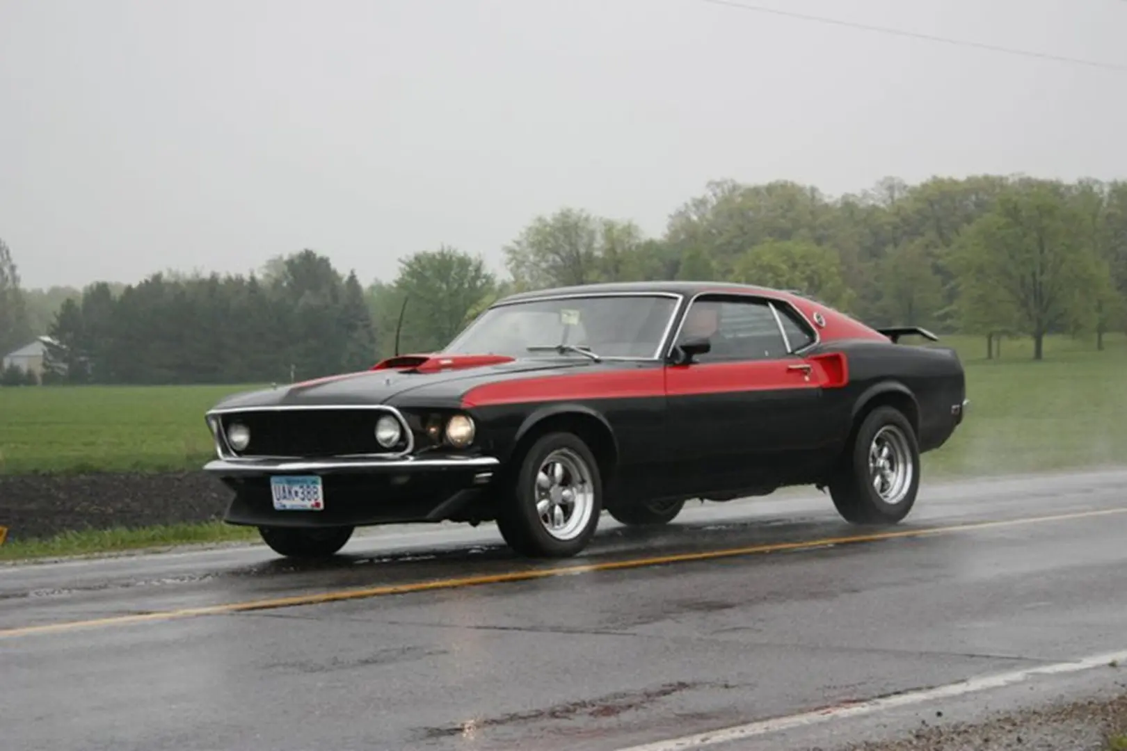 Vintage muscle car with red accents
