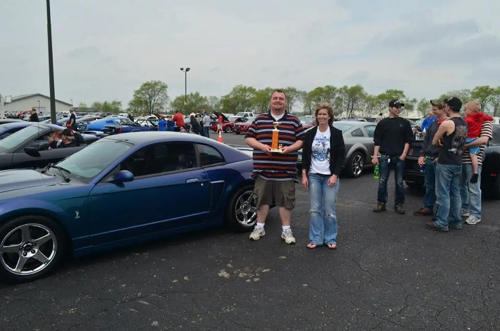 Blue car with group of people