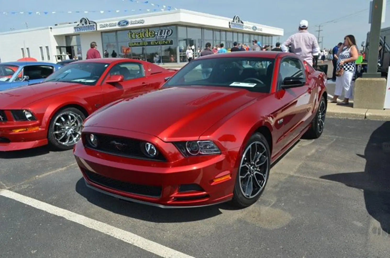 Shiny red car at a car show