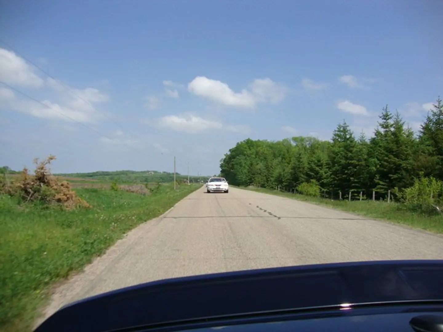 Car driving on rural road