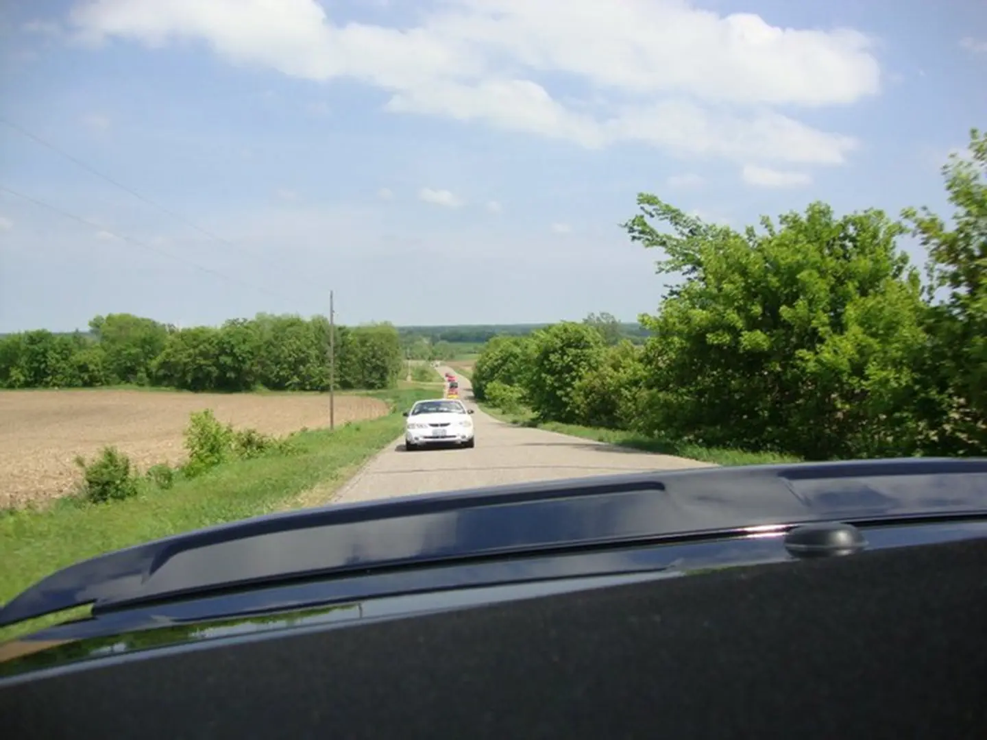 Scenic road with trees and fields