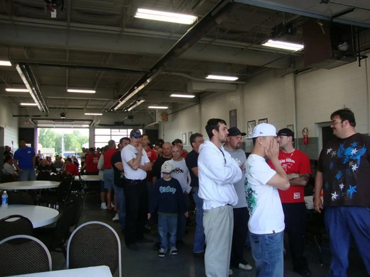 Queue forming in a large room.