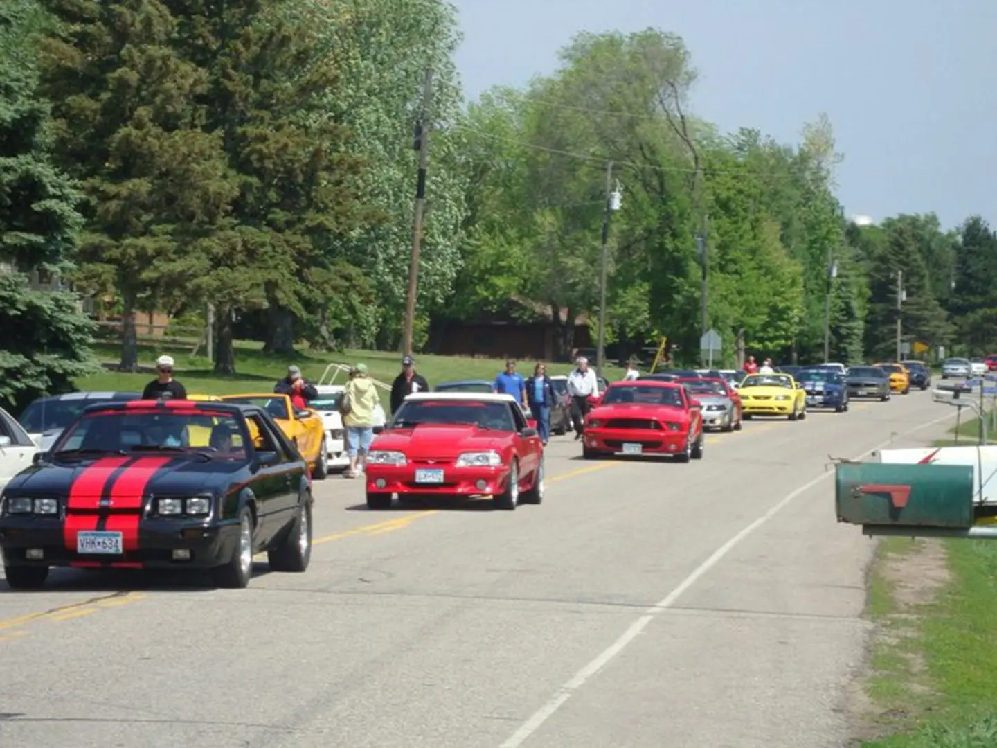 Colorful cars on a rural road