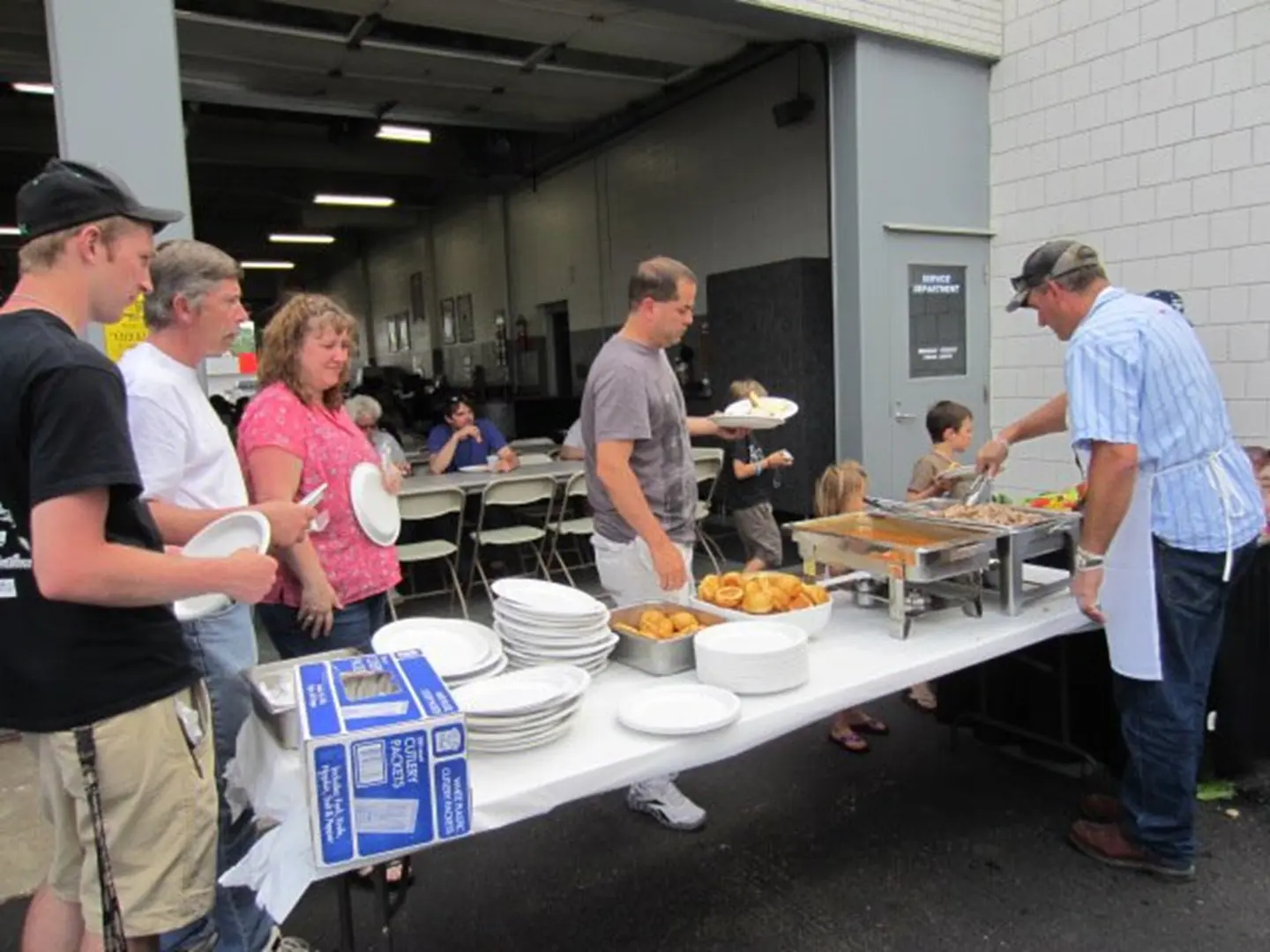 Serving food at community event