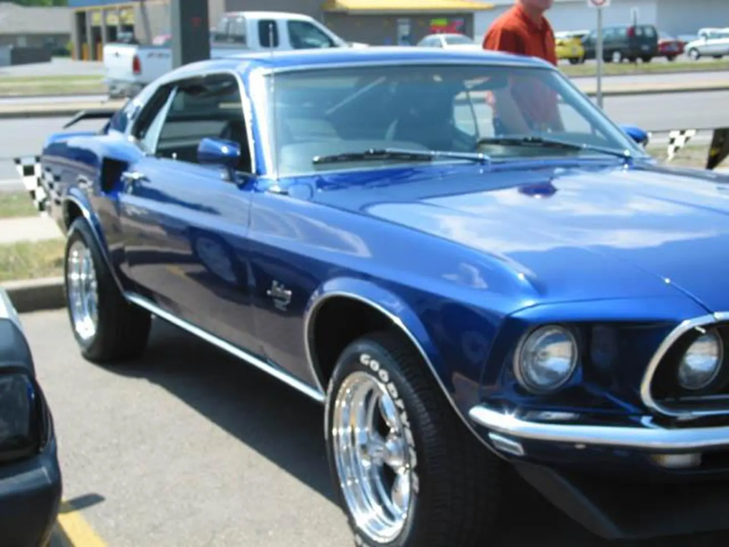 Blue vintage muscle car parked outside