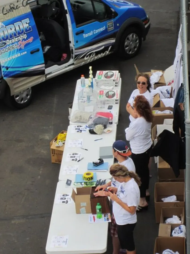 Volunteers organizing items on tables