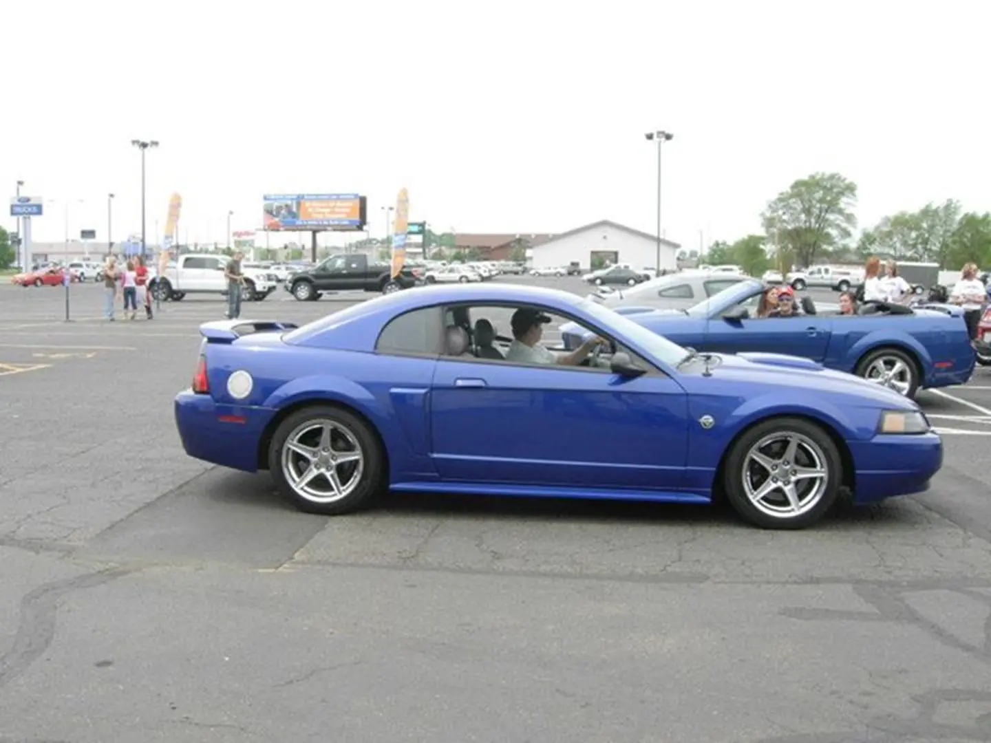 Blue sports car parked in lot