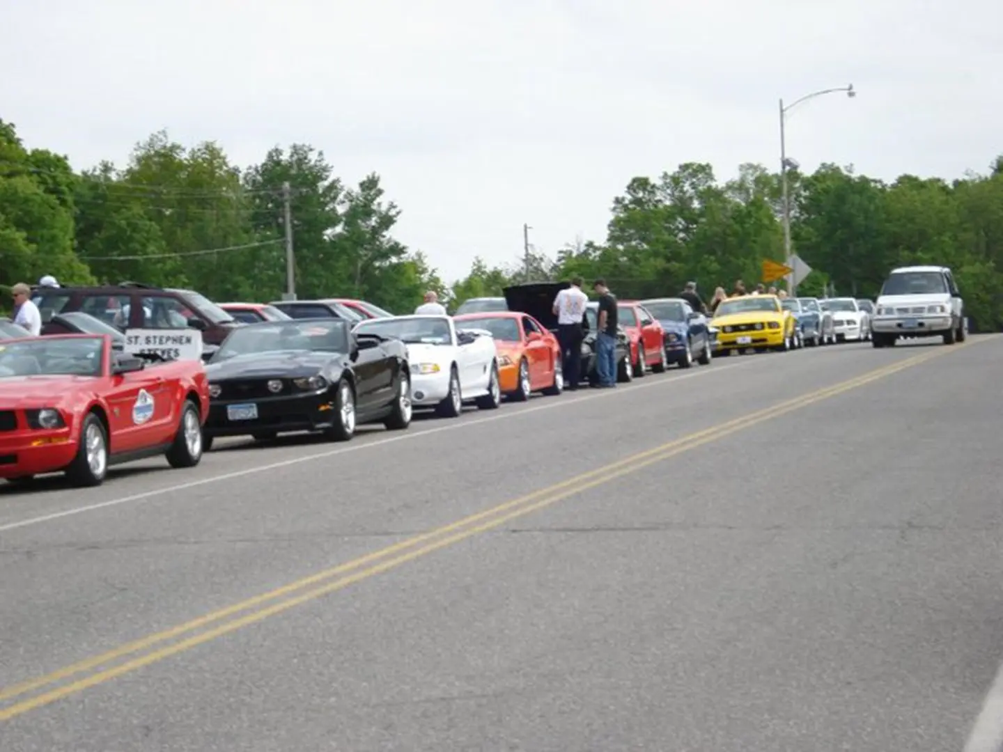 Car enthusiasts meeting on a clear day