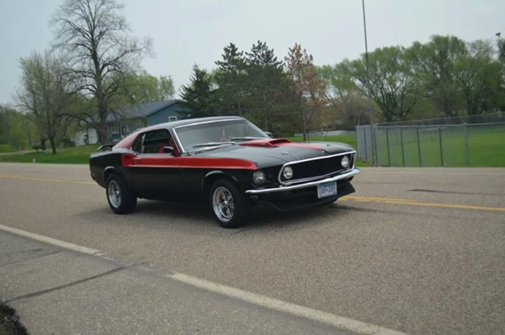 Vintage car cruising through countryside