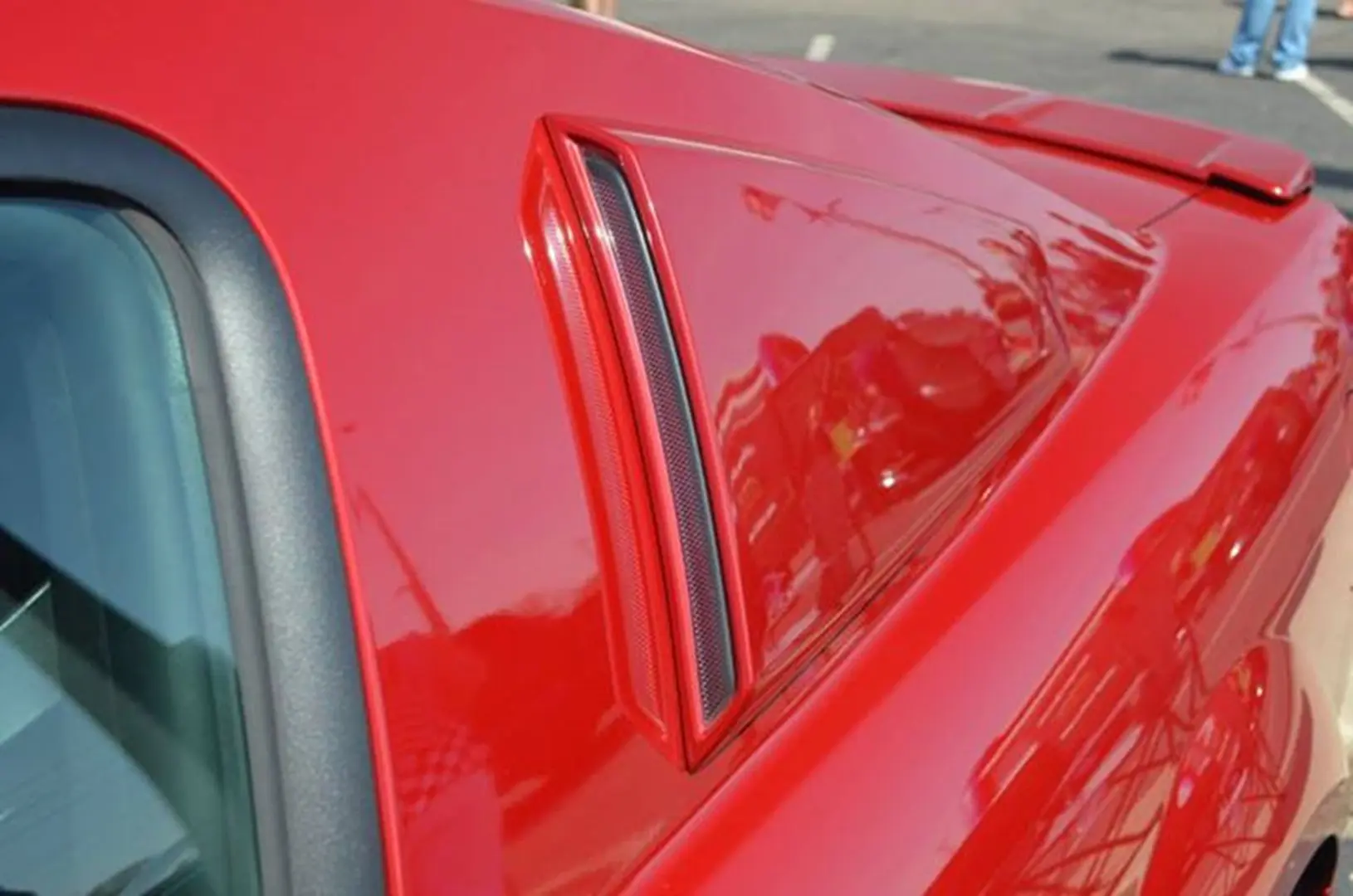 Red car with stylish side vent