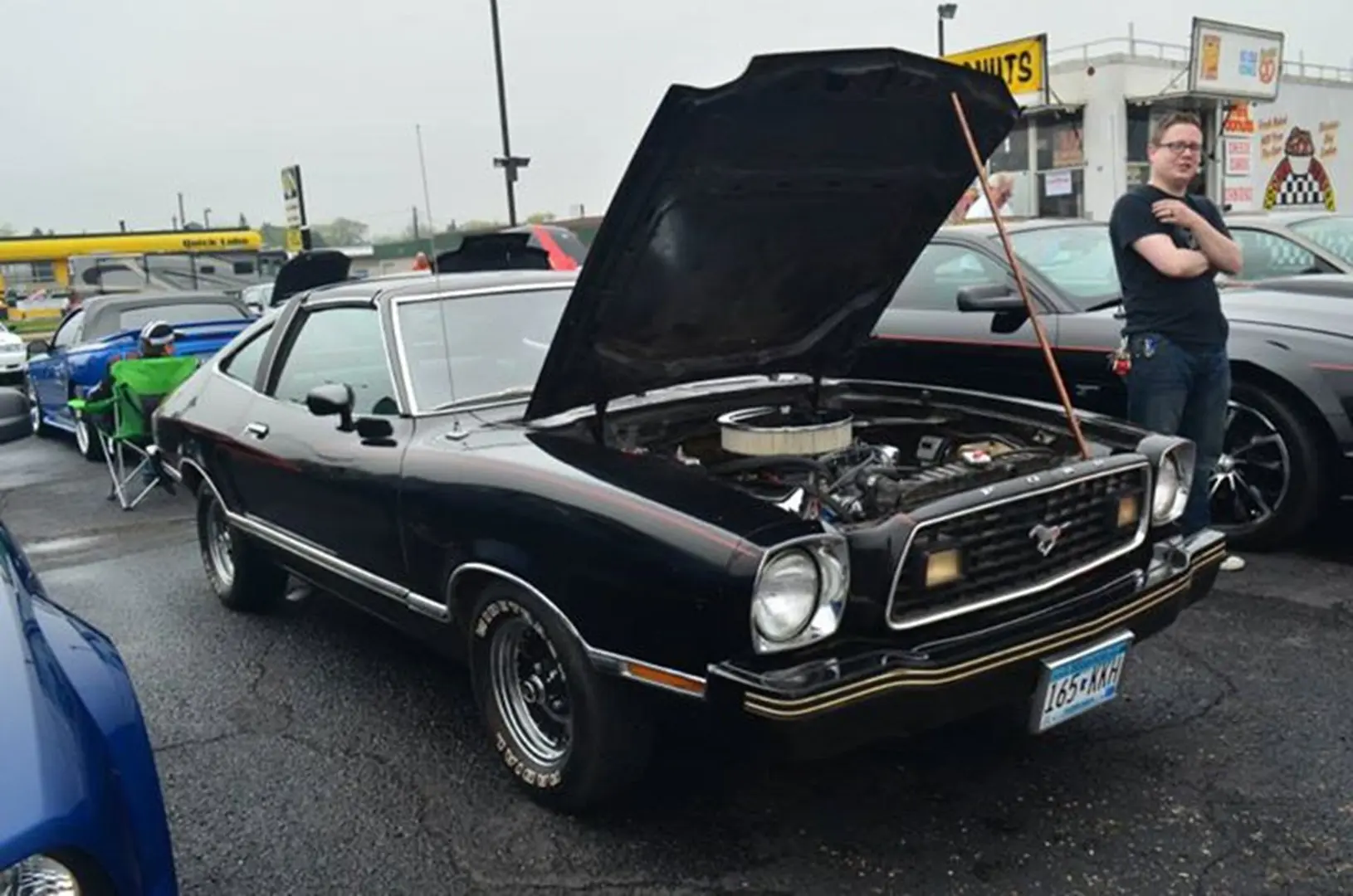 Classic black car with hood open