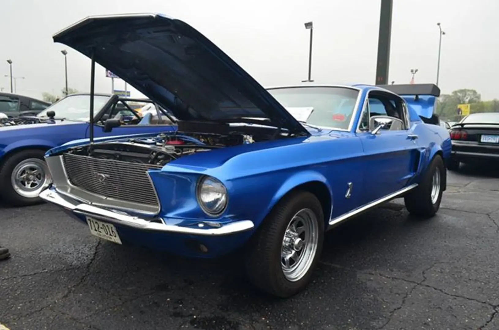 Classic blue car with hood open