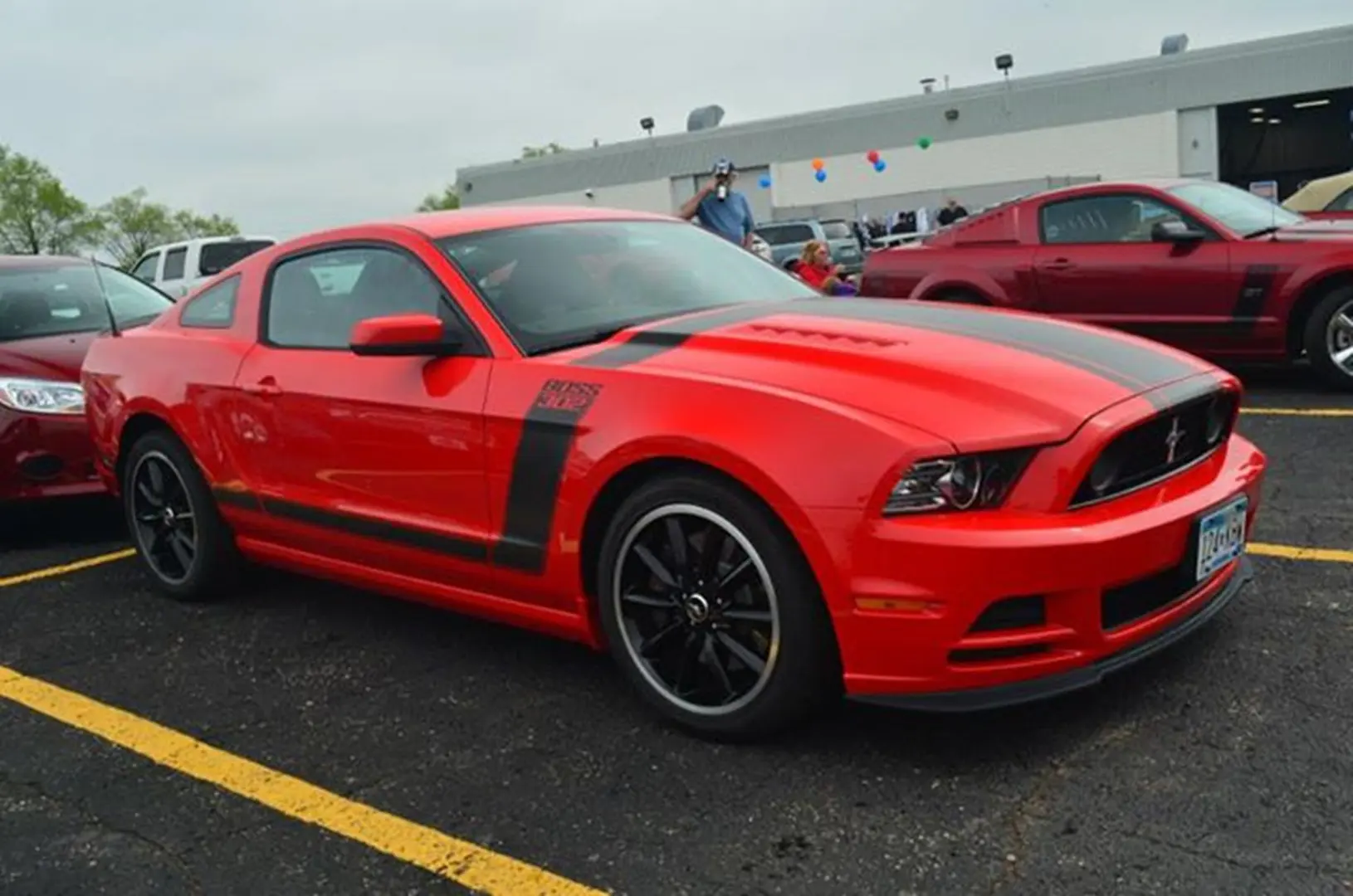 Red sports car parked in lot