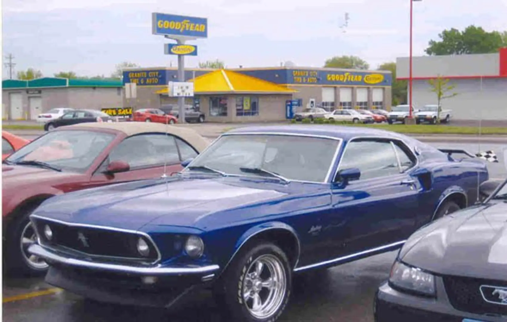 Retro vehicle outside Goodyear store