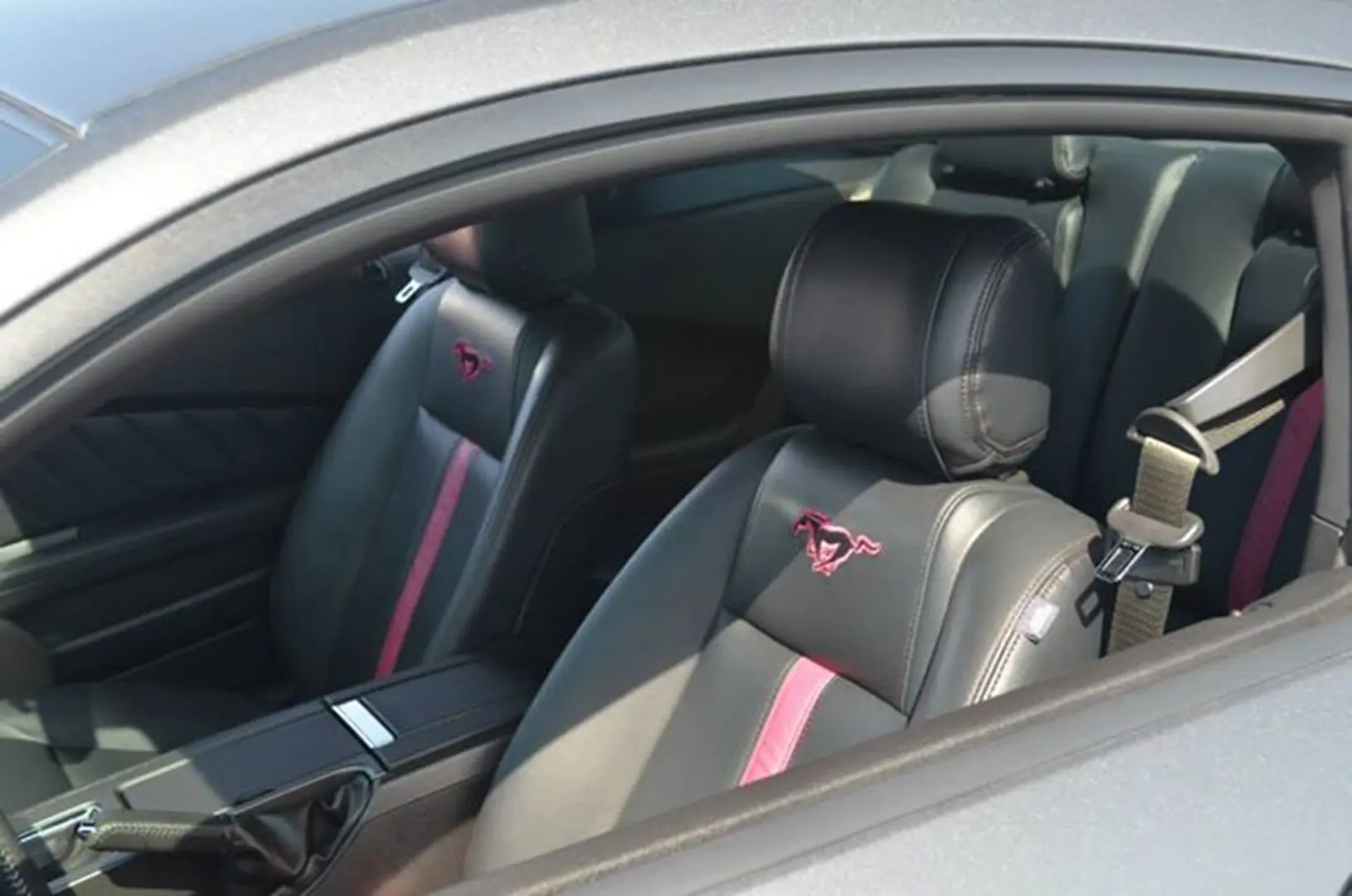 Front car seats with unique emblem design