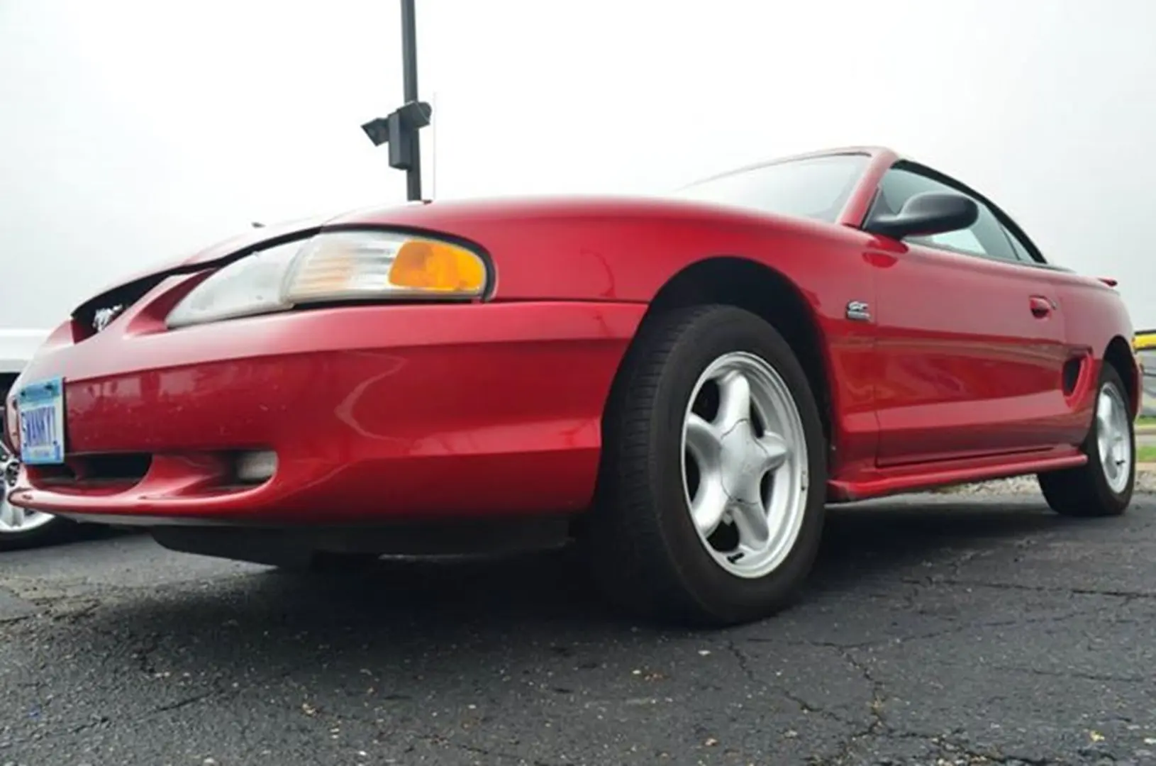 Classic red coupe on asphalt