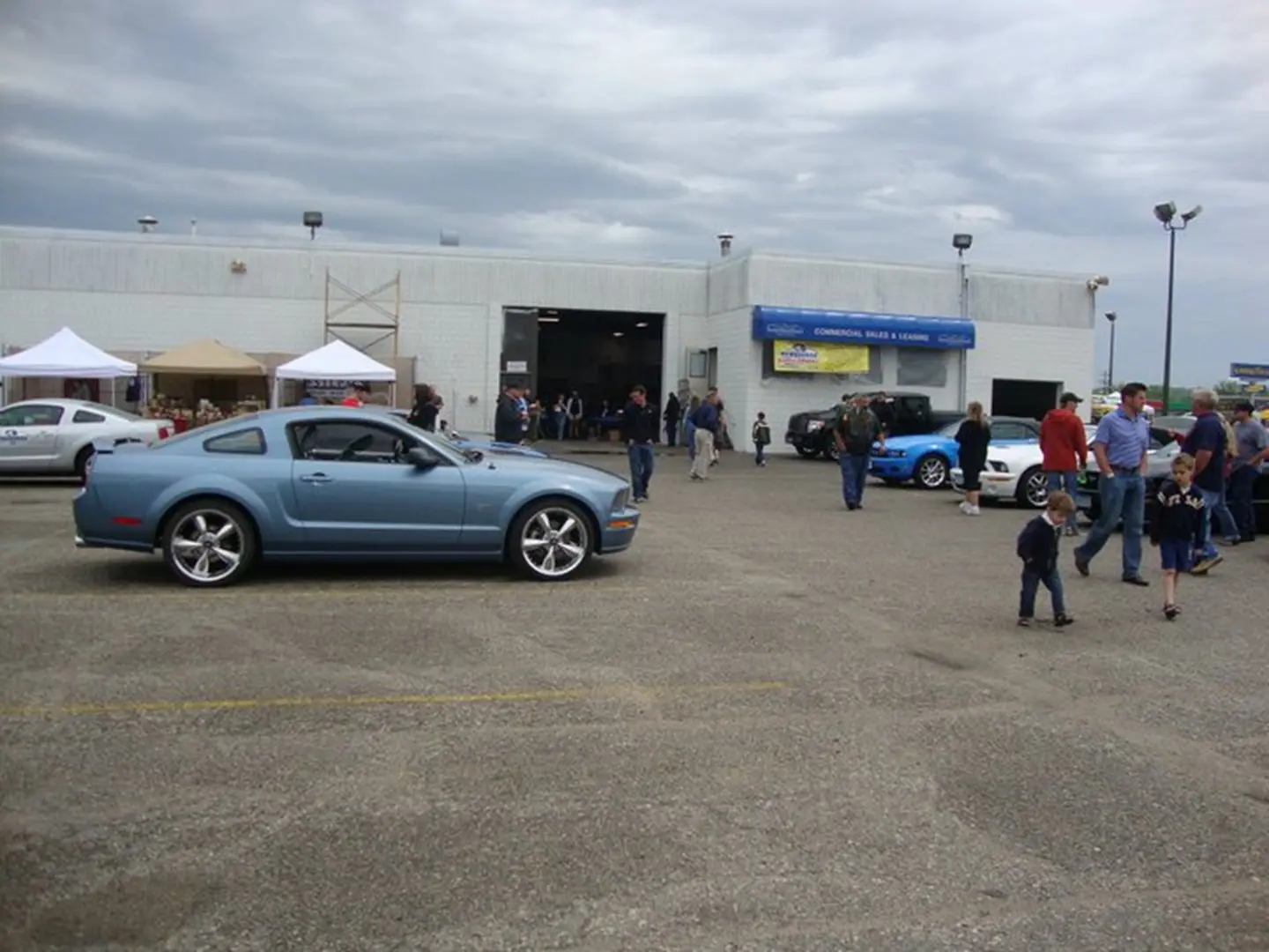 Outdoor automotive gathering scene