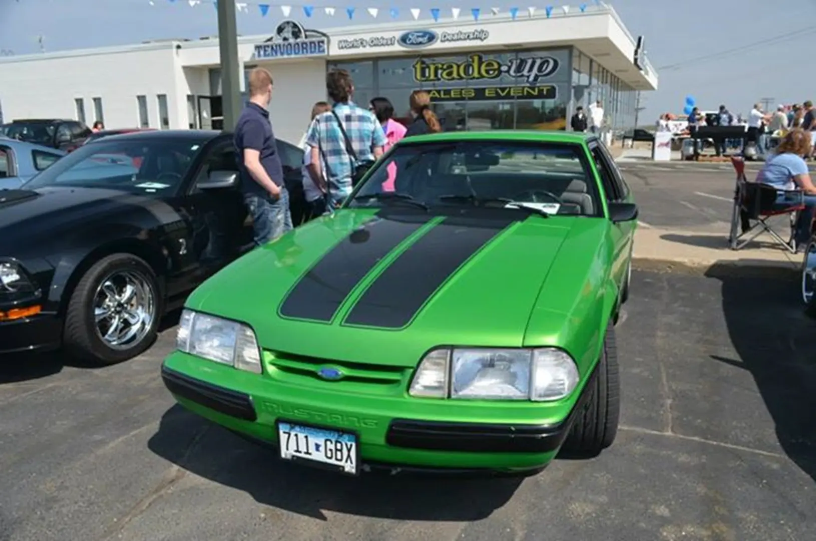 Green vintage car at auto event