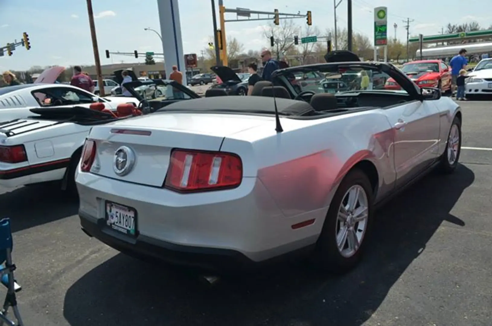 Silver car with top down at car event