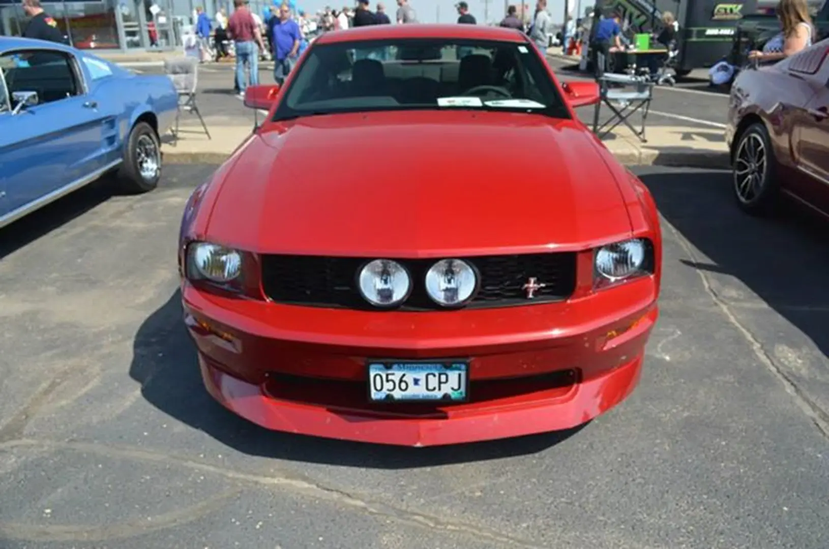 Red car at outdoor auto show