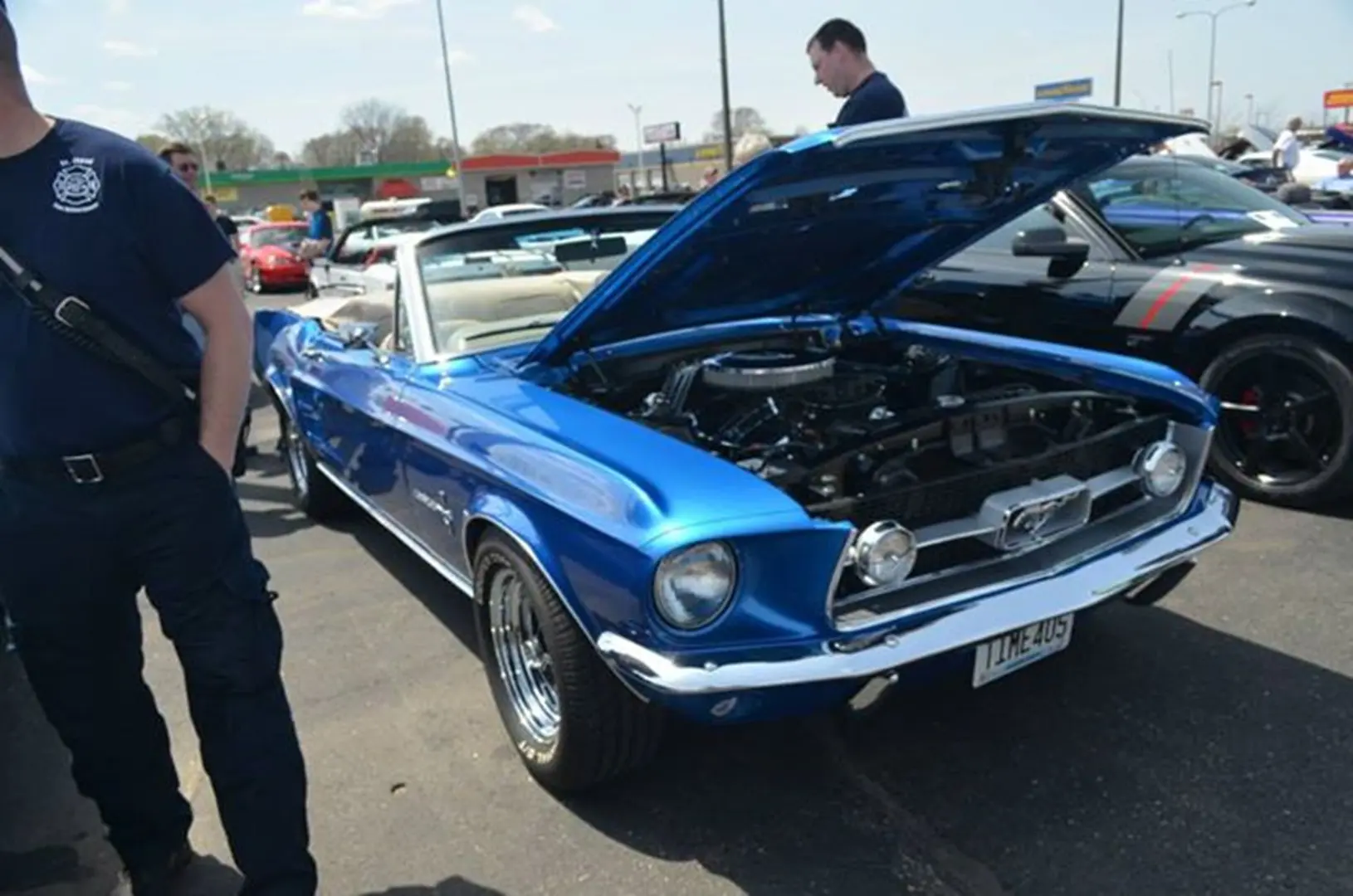 Blue classic convertible car with open hood