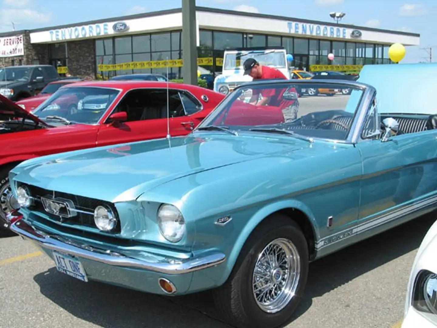 Shiny retro vehicles at dealership event