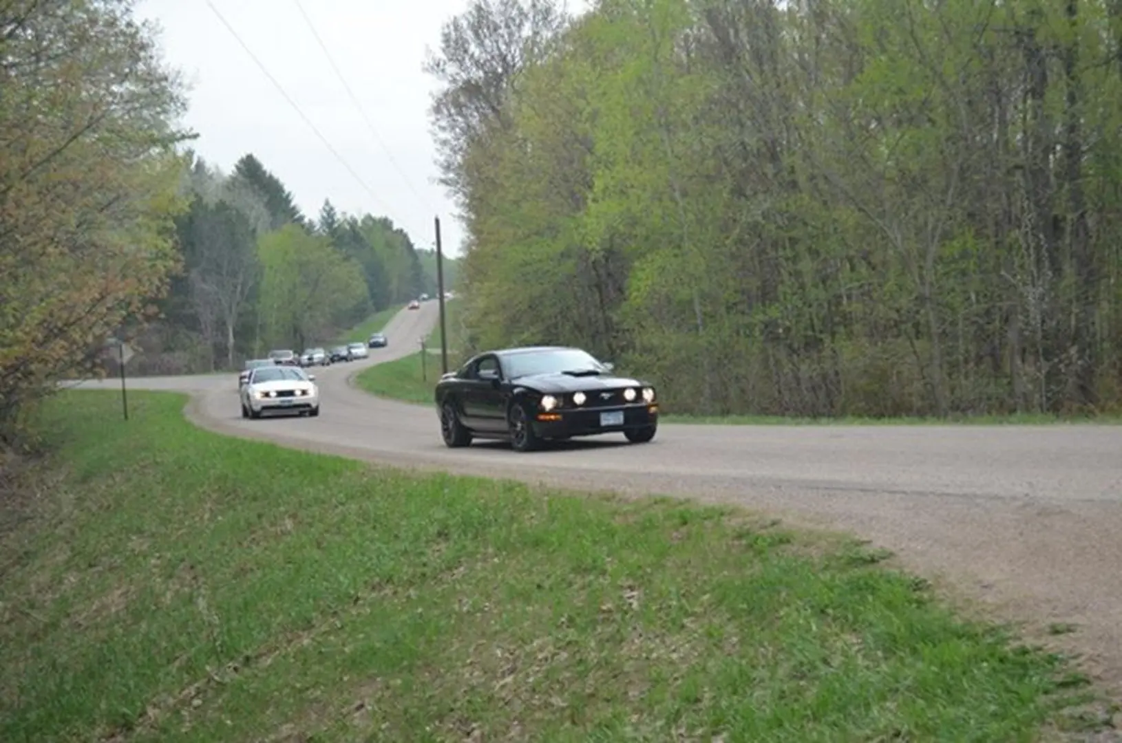 Two cars navigating a winding road